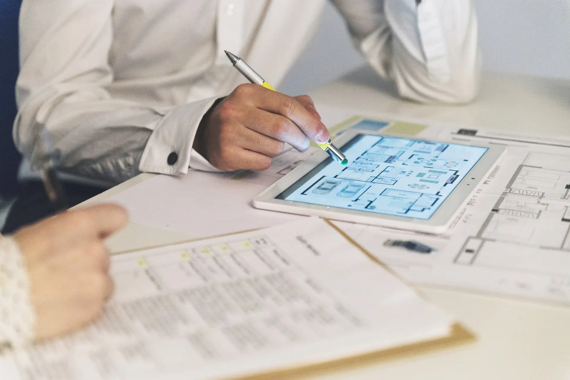 crop-people-working-with-plans-tablet